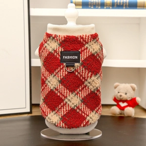 Detail of red plaid warm pet vest with leather FASHION patch and metal D-ring for leash