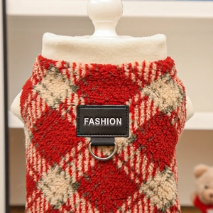 Detail of red plaid warm pet vest with fashion leather patch and metal D-ring for leash