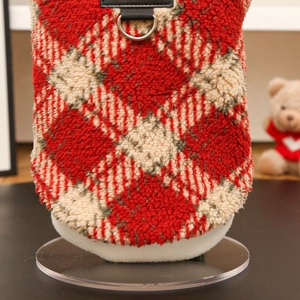 Detail of red and white checkered fleece pet coat with a durable metal D-ring attachment