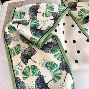 Green ginkgo leaf and polka dot reversible silk scarf with vibrant green piping