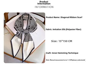 Detail of houndstooth diagonal scarf with internal seam stitching on smooth fabric