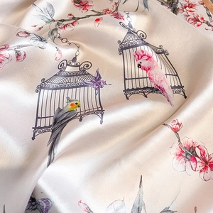 Elegant mulberry silk square scarf featuring parrot and floral prints with satin sheen