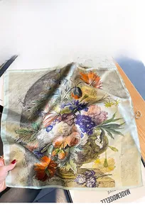 Detailed view of vintage floral silk scarf texture and elegant oil painting pattern