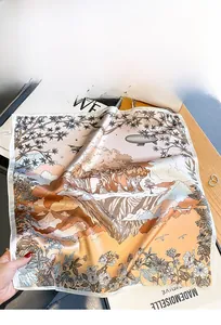 Detail of luxury silk scarf showing vintage jungle art prints and satin gloss texture