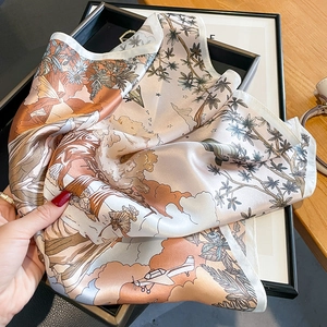 Champagne silk scarf with vintage aviation and floral print shown on artistic background