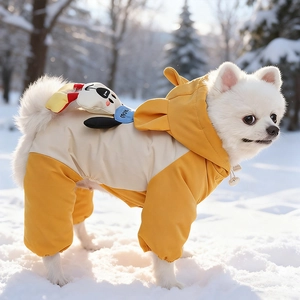 Detail of waterproof dog snowsuit with 3D cartoon dog plush and adjustable hood on snow