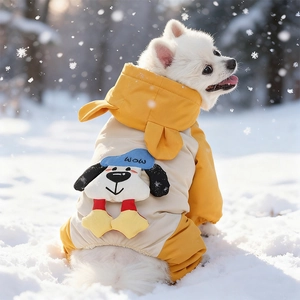 Close-up of waterproof dog winter jacket with cartoon patch and hood in snowy outdoor