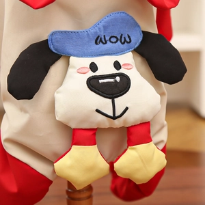 Close-up of a cartoon dog embroidery patch on a thick waterproof pet winter coat