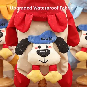 Detail of waterproof dog snowsuit fabric showing water droplets on red material