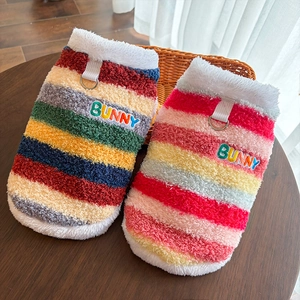Close-up of rainbow striped pet vests with fleece lining and BUNNY embroidery detail