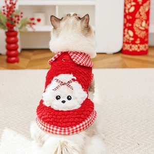 Detail of red fleece pet vest featuring white teddy patch and plaid bow on cat back