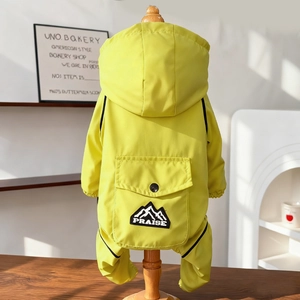 Detail view of the waterproof dog jumpsuit with a hood and PRAISE mountain logo