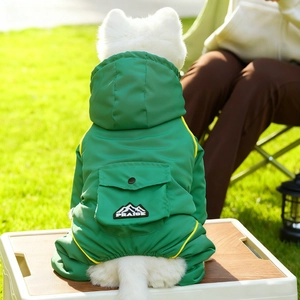 Close-up of waterproof dog outdoor jacket featuring mountain logo and yellow trim