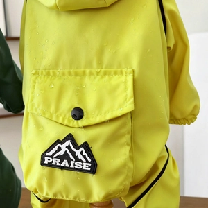 Detailed view of waterproof fabric with water droplets on yellow pet winter jacket