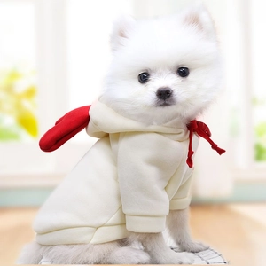 Off-white pet hoodie with red heart wings and drawstring, modeled by a Pomeranian dog