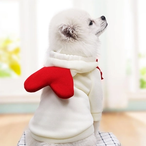 White pet hoodie for dogs with a red heart decoration on the back, shown on a Pomeranian