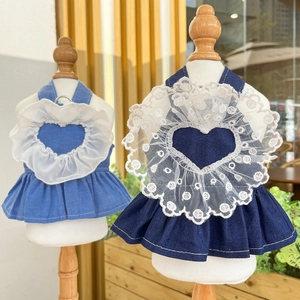 Detail of pet denim dress featuring heart-shaped lace trim and a metal D-ring for leashes