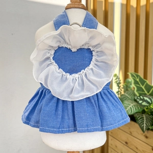 Detail of dog denim princess dress with white lace heart and metal D-ring for leash