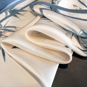 Elegant 100% mulberry silk square scarf with pearl white base and teal bamboo leaf pattern