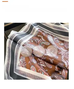 Detail showing elegant paisley pattern and satin silk texture on this square scarf