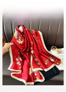Long silk-feel scarf with red floral bird print and beige border styling