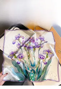 Detail of silk scarf featuring vintage purple iris floral patterns on a grey background