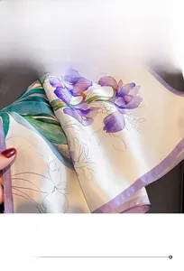 Detail of premium silk scarf featuring violet iris print and high-density rolled hem