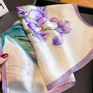 Elegant silk scarf featuring purple iris floral prints and smooth satin finish texture