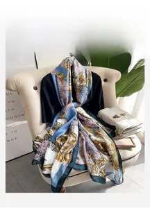 Detail of floral baroque silk scarf tied on black outfit for an elegant outdoor style