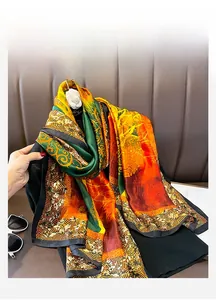 Detailed macro view of vintage floral silk scarf texture with gold and orange patterns