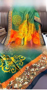 Detail of printed silk scarf showing intricate tree patterns and precise stitched edges