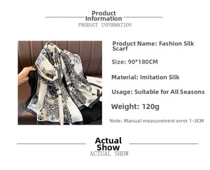 Detail of floral print silk-feel shawl showing 90x180cm size and soft texture