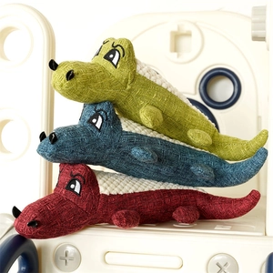 Three colorful plush crocodile dog toys with textured knit fabric and embroidered details