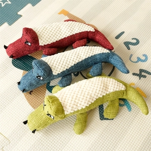 Three colorful corduroy crocodile chew toys for dogs with textured back for cleaning teeth