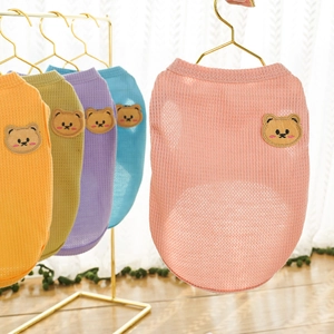 Detail of waffle knit dog vest showing breathable fabric texture and cute bear patch