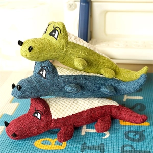 Detailed texture of durable corduroy and mesh fabric on three colorful plush crocodile pet toys