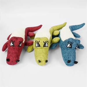 Detailed view of plush crocodile pet toys in red, green, and blue with textured fabric