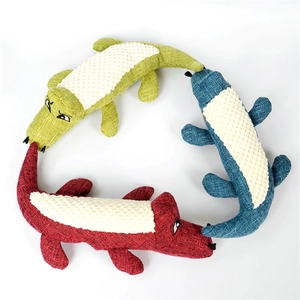 Detailed view of three plush crocodile pet toys in red, green, and navy blue fabric