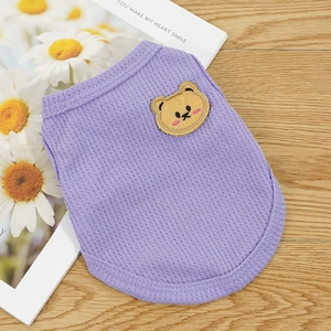 Close-up of lilac waffle-knit dog vest featuring a cute brown bear embroidery detail