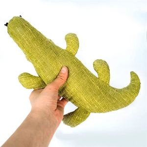 Close-up of green crocodile plush pet toy showing durable woven fabric texture