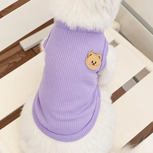 Close-up of lavender waffle knit pet vest featuring a cute brown bear embroidery