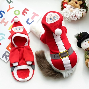 Detail of red Christmas pet costume with white plush trim and Santa Claus hood design