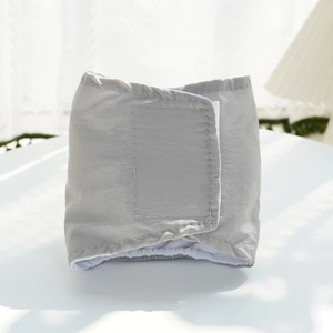 Detail view of adjustable velcro and elastic edges on the gray washable dog belly band