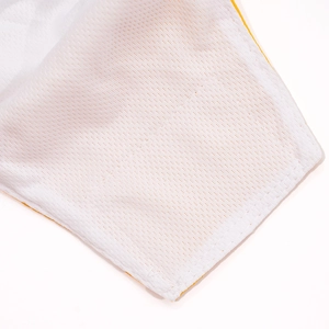 Detail of breathable white mesh fabric and yellow hem of the dog physiological diaper
