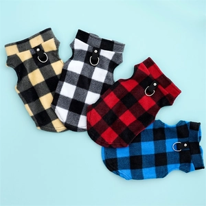 Detail of checkered fleece dog vests with D-ring leash attachments in multiple colors