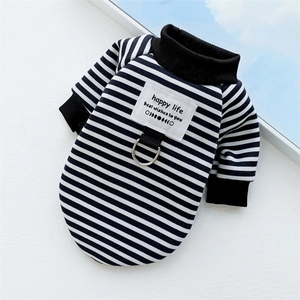 Detail of striped pet sweater featuring metal D-ring attachment and happy life woven label