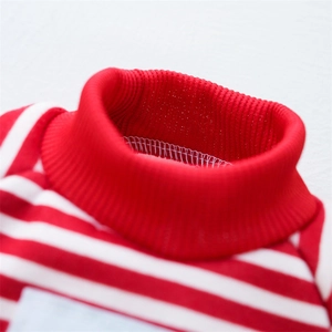 Close-up of red and white striped pet sweater with knitted ribbed collar detail