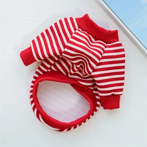 Detail of red and white striped pet sweater showing soft fleece texture and ribbed cuffs