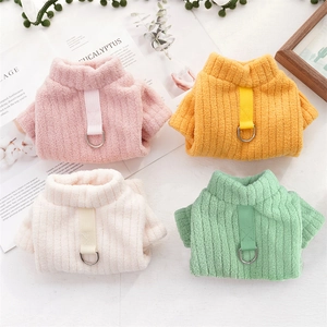 Detail of warm dog sweaters with D-ring connectors in four pastel colors and soft velvet fabric