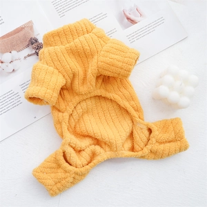 Thick warm ginger yellow knitted pet sweater for dogs and cats in a cozy winter setting